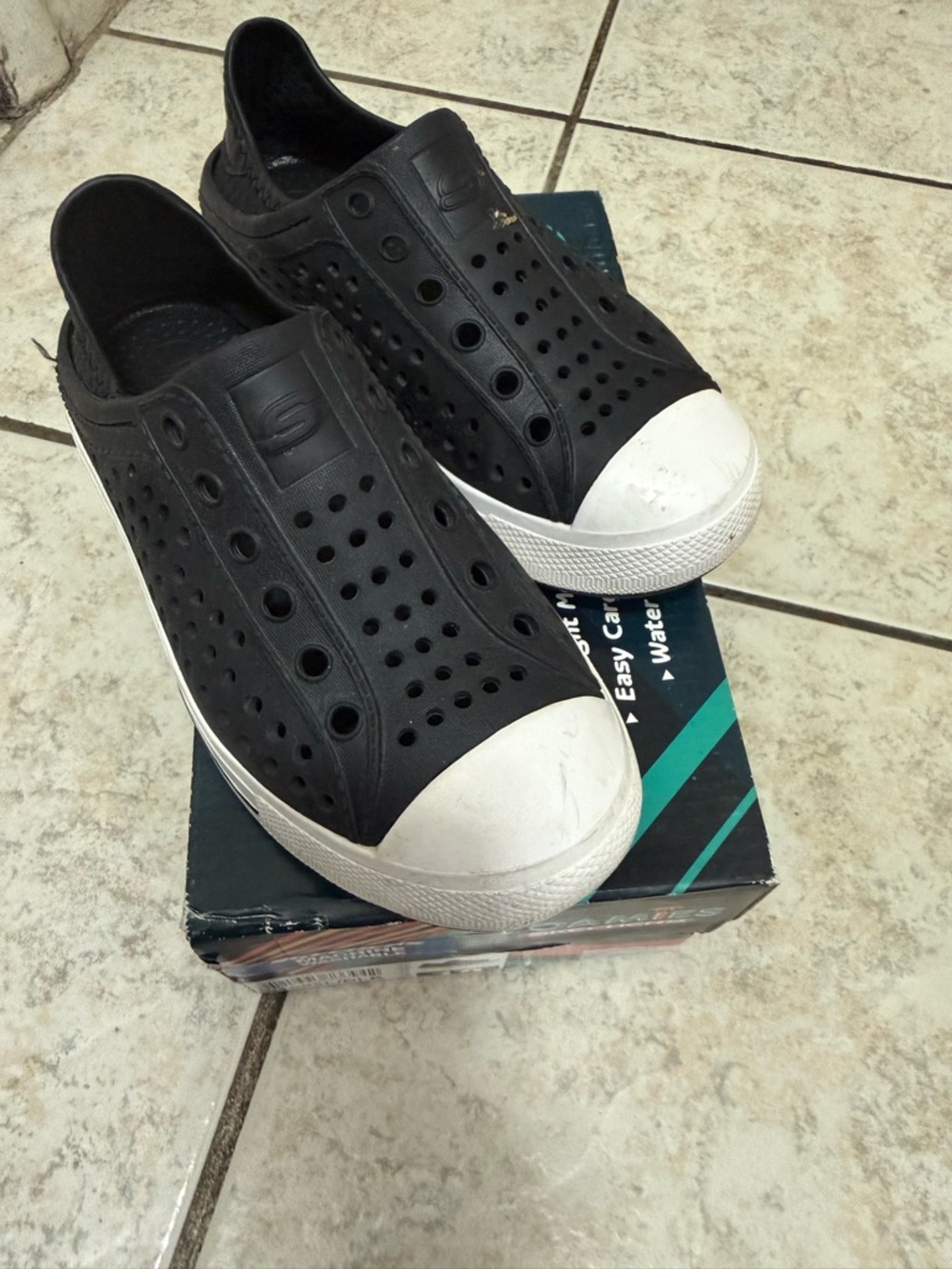 Skechers Black Slip-On Perforated Casual Shoes with White Toe Cap